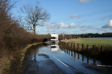 flood, truck, field Truck driving by a flooded field